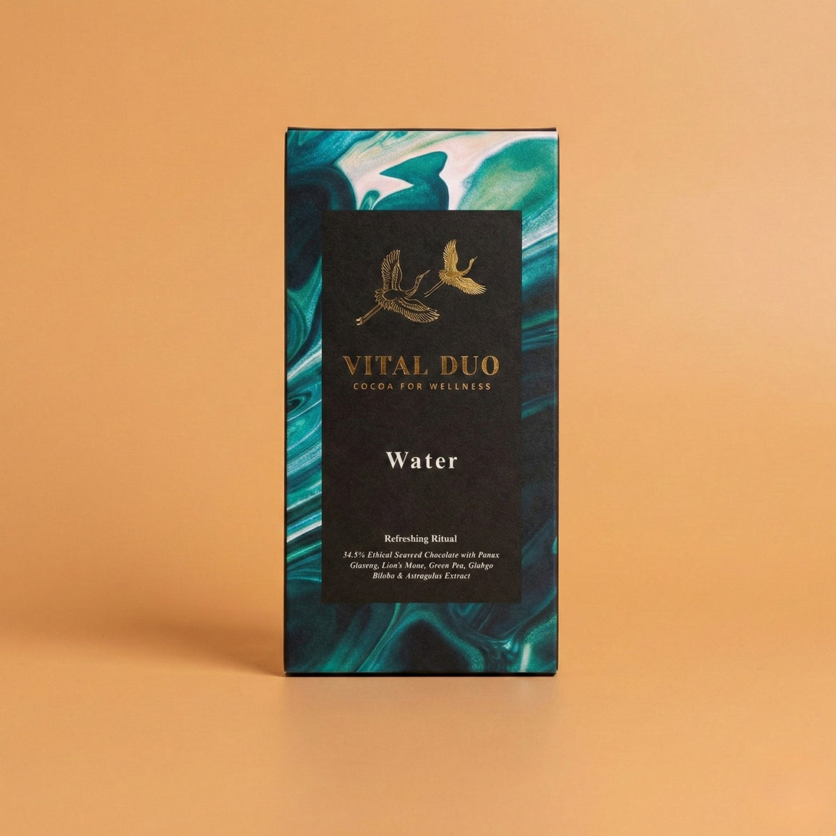 Vital Duo Water herbal ritual kit box, featuring a black central label with gold bird illustrations and teal and white marbled borders, set against a solid peach background.